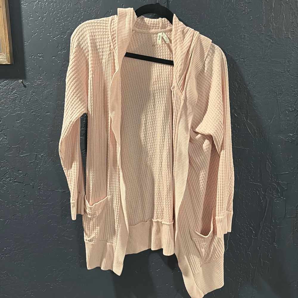 Soft pink cardigan with pockets and hood